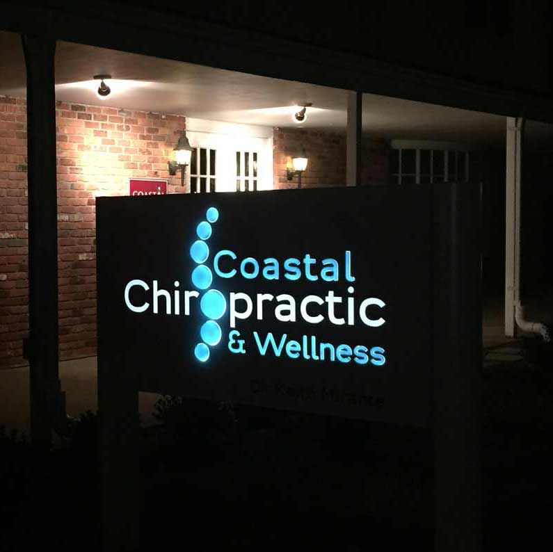 Coastal Chiropractic & Wellness sign at Night